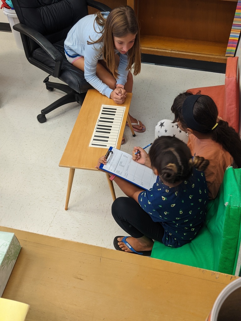 Students working at a musical table
