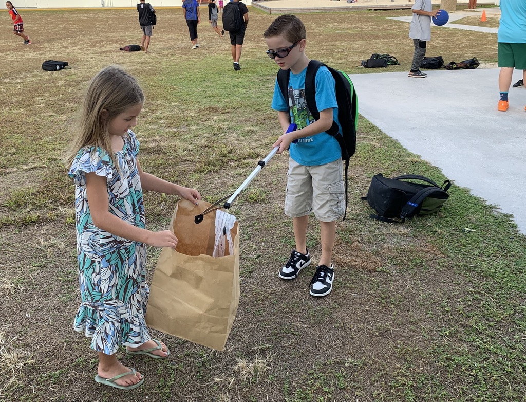 students picking up trash